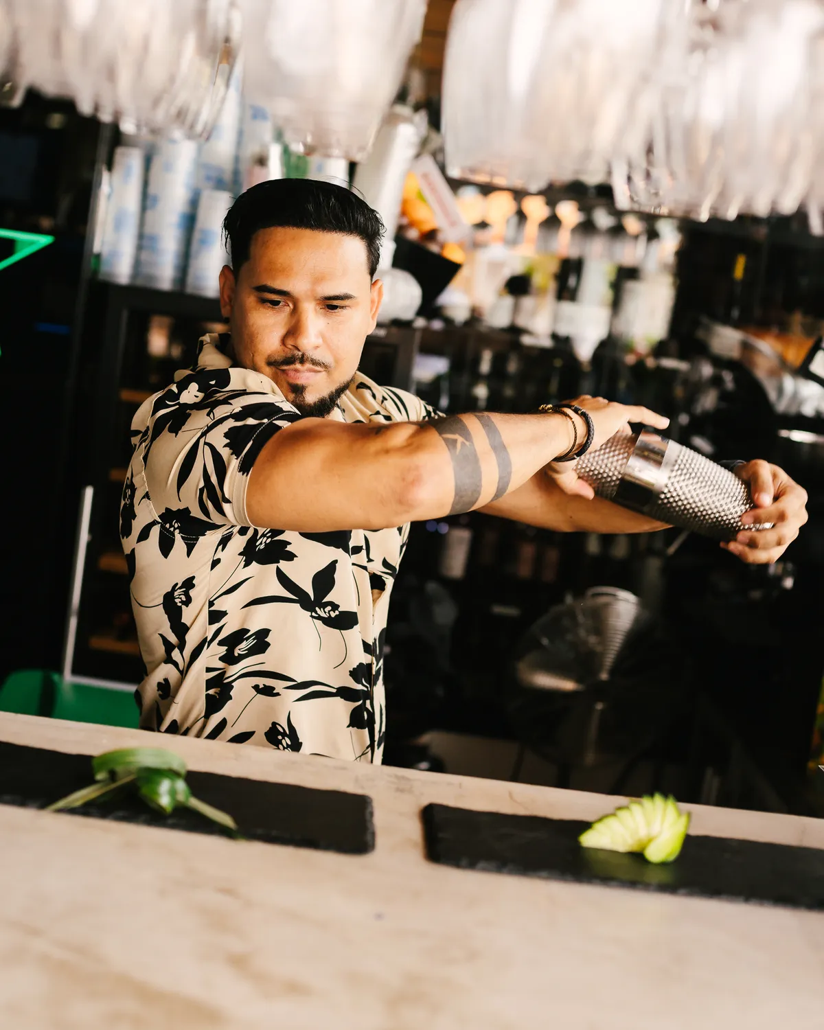 Bartender mixing cocktails at the beach club in Marbella